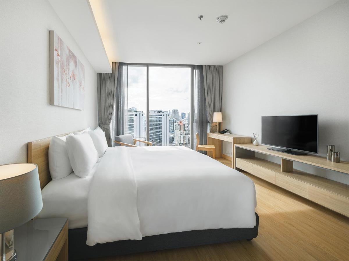 Oakwood Suites Bangkok Exterior foto Deluxe Room