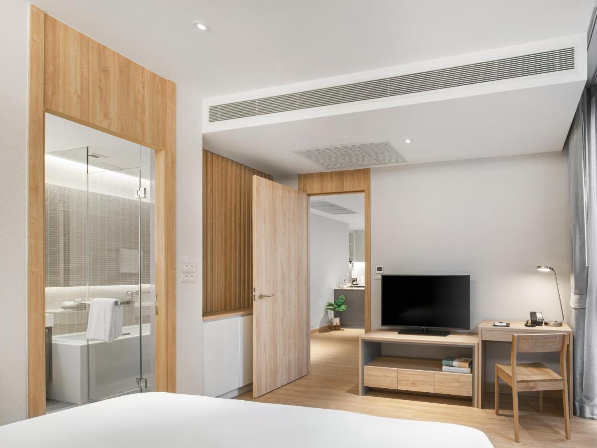 Oakwood Suites Bangkok Exterior foto Deluxe Room