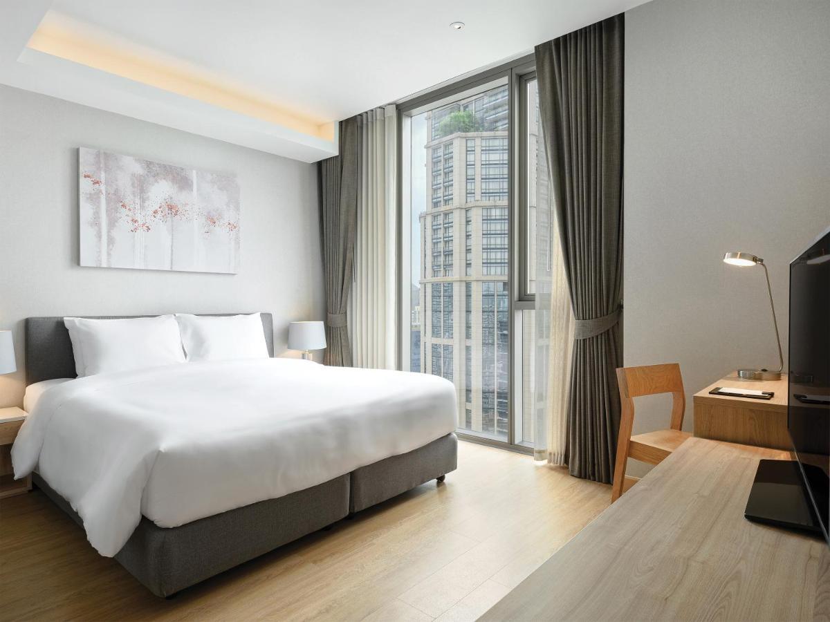 Oakwood Suites Bangkok Exterior foto Deluxe Room