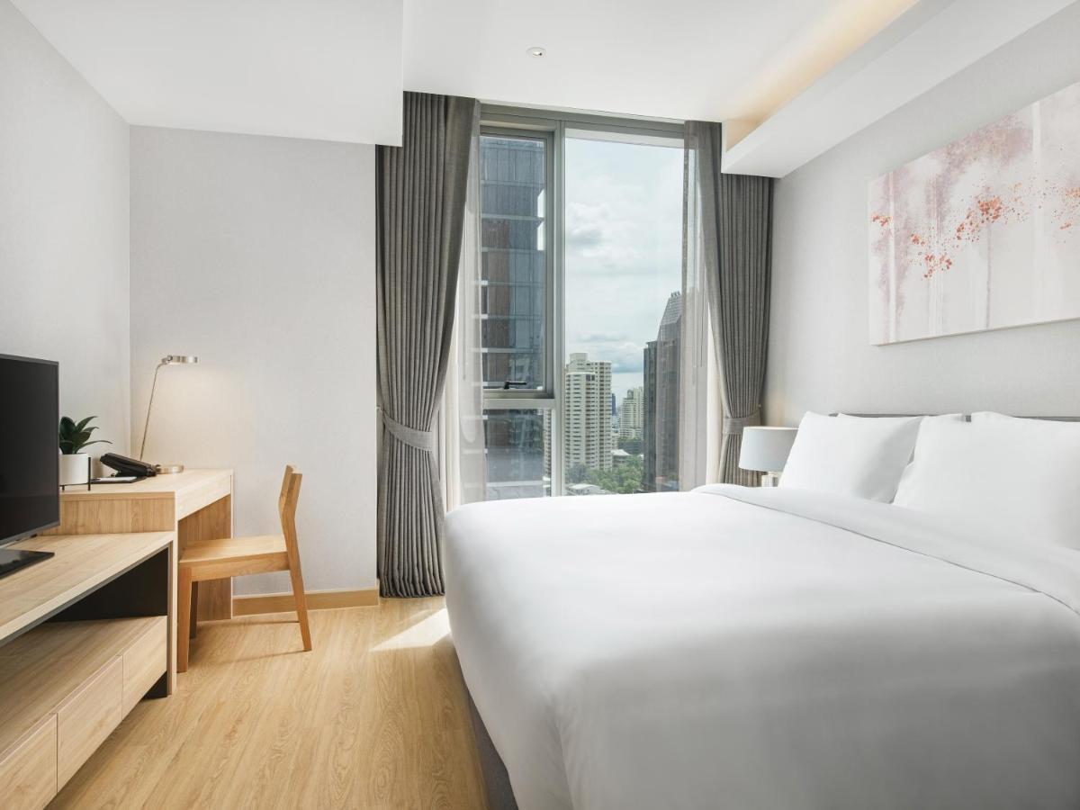 Oakwood Suites Bangkok Exterior foto Deluxe Room