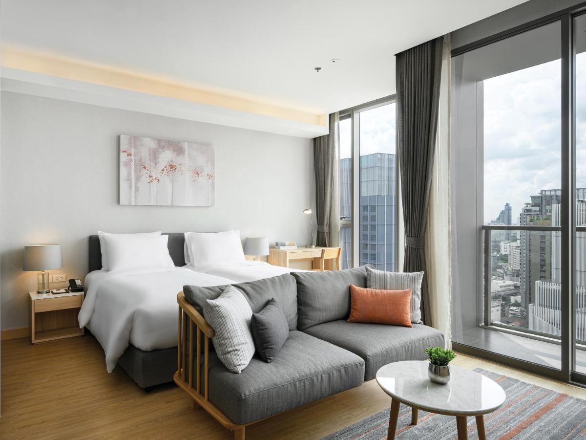 Oakwood Suites Bangkok Exterior foto Deluxe Room