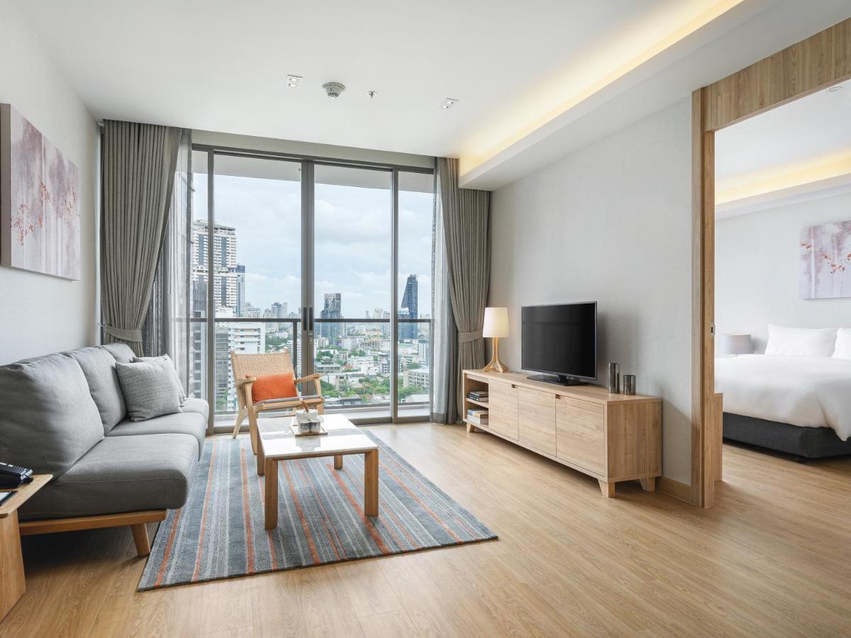 Oakwood Suites Bangkok Exterior foto Living room