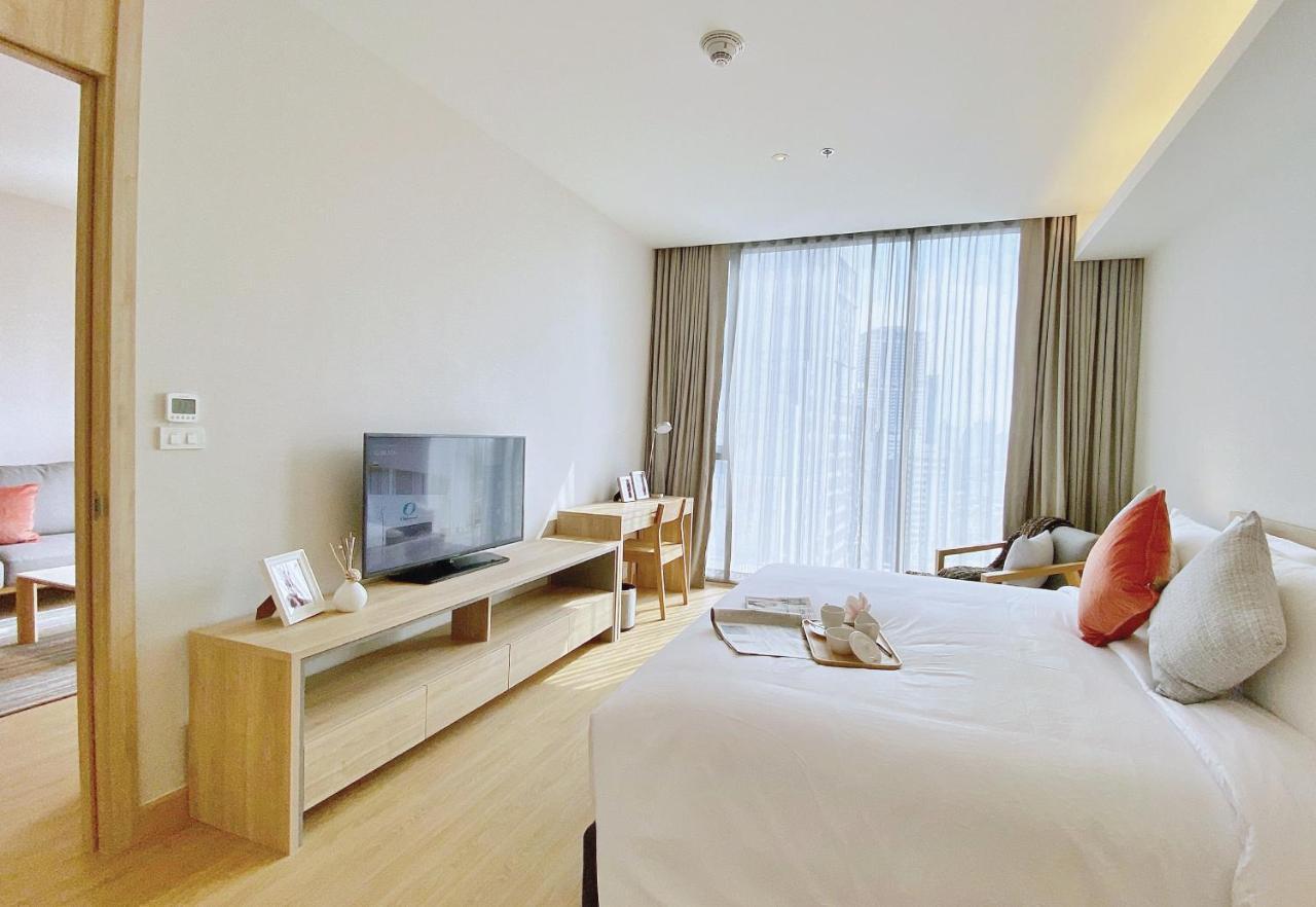 Oakwood Suites Bangkok Exterior foto Deluxe Room